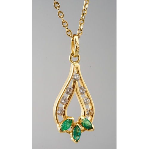 28 - A 9ct yellow gold emerald and diamond pear shape pendant necklace, set with three marquise emeralds ... 