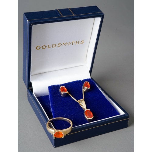 32 - A suite of 14k yellow gold and fire opal, including a ring, size N, a pendant necklace, and a pair o... 