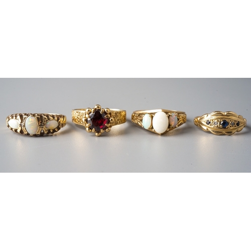 37 - A 9ct yellow gold and garnet ring, size N; two 9ct yellow gold and opal rings, sizes M and M1/2; and... 