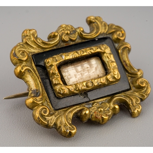 56 - Two 19th century mourning brooches, one set with seedpearls, the other with black enamel, total gros... 