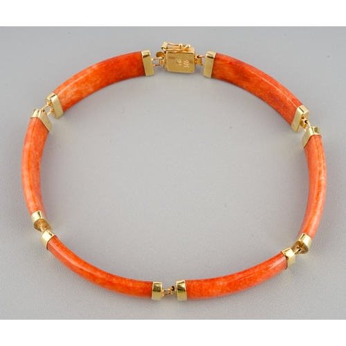 60 - A Chinese 14k yellow gold and orange jade bracelet, approx 7.5cm long, gross weight approx 11.8g