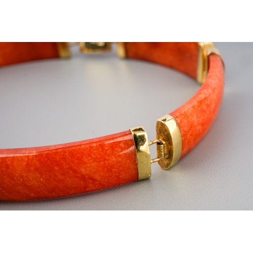 60 - A Chinese 14k yellow gold and orange jade bracelet, approx 7.5cm long, gross weight approx 11.8g