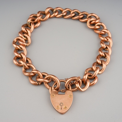 64 - 9 ct gold curb link bracelet with heart padlock, 12.4 g gross weight