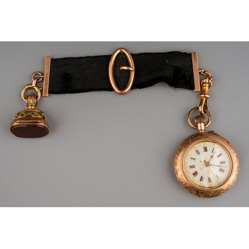 67 - 9 ct gold ladies fob watch, metal inner case, cracked glass. Suspended from silk ribbon mounted in y... 