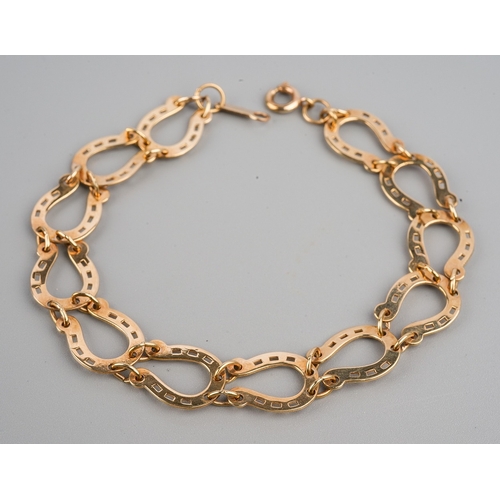 70 - Equestrian Interest - a 9ct yellow gold horseshoe link bracelet, approx 6.5cm long, gross weight app... 