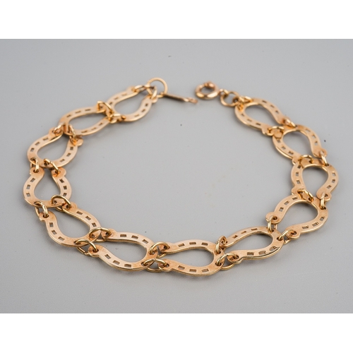 70 - Equestrian Interest - a 9ct yellow gold horseshoe link bracelet, approx 6.5cm long, gross weight app... 