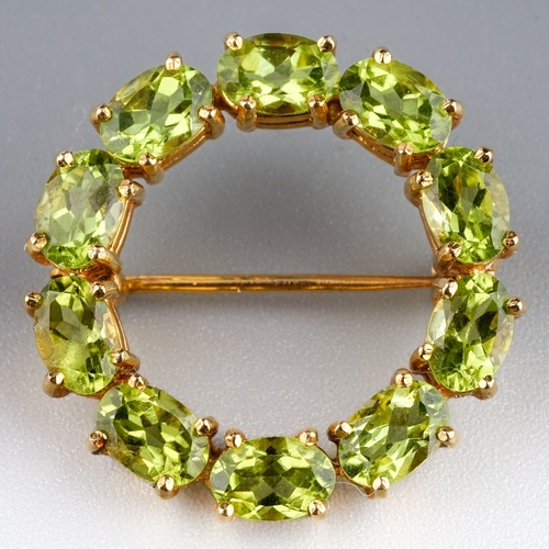 76 - Peridot 9ct Circular Brooch