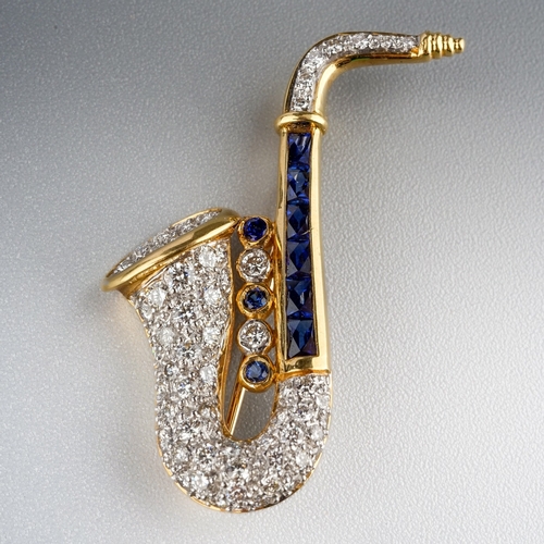 83 - Sapphire and Diamond Saxophone brooch 18ct