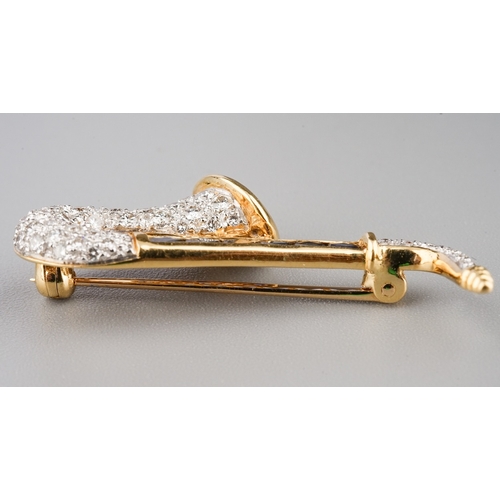 83 - Sapphire and Diamond Saxophone brooch 18ct