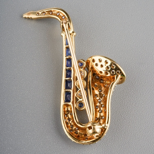 83 - Sapphire and Diamond Saxophone brooch 18ct