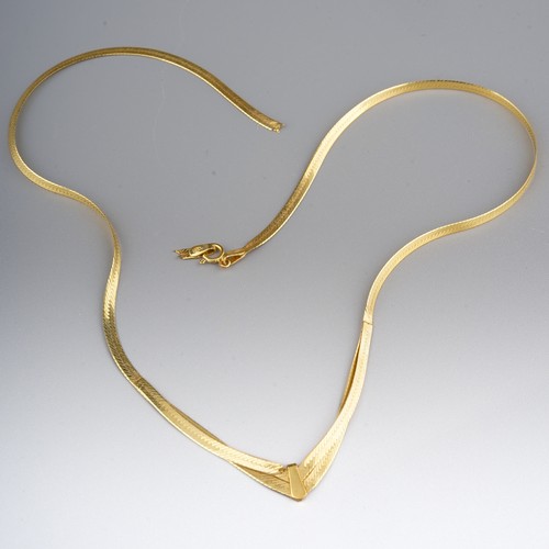 85 - A 9ct yellow gold plaited necklace with heart centre, approx 9g; togher with a broken 9ct gold chain... 