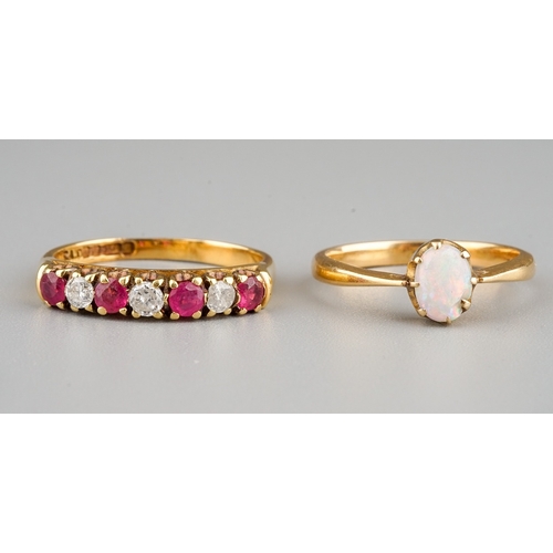 92 - An 18ct yellow gold diamond and ruby seven-stone ring, diamond weight stamped to shank '0.20', size ... 