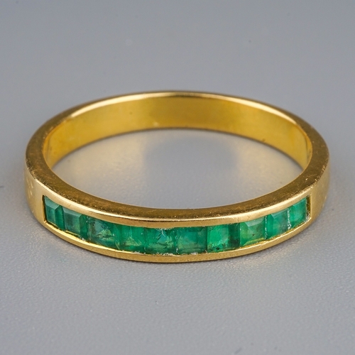 97 - A yellow gold and emerald half eternity ring, size P1/2, unmarked assessed as approx 14k-18k, gross ... 