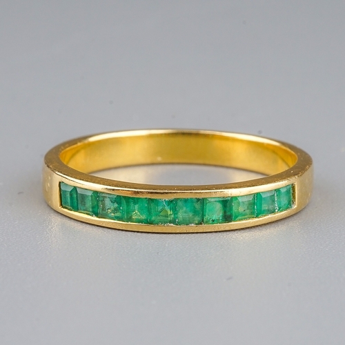 97 - A yellow gold and emerald half eternity ring, size P1/2, unmarked assessed as approx 14k-18k, gross ... 