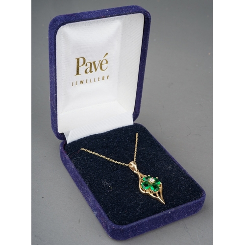 101 - A 9ct yellow gold pendant necklace, set with a CZ surrounded by heart-cut green stones, total gross ... 