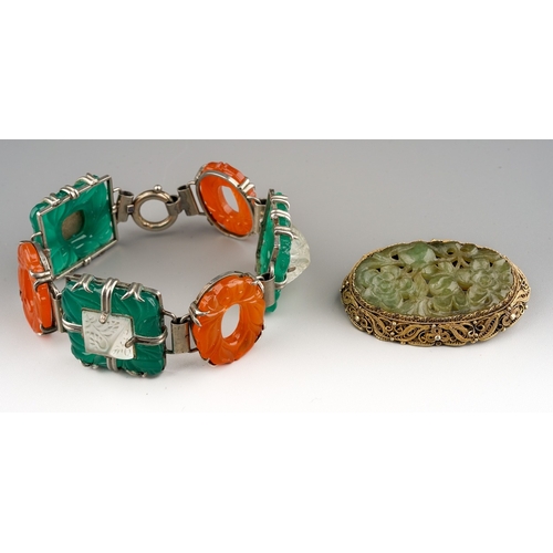 102 - A white metal a coloured paste bracelet, approx 20cm long; together with a carved green stone brooch... 