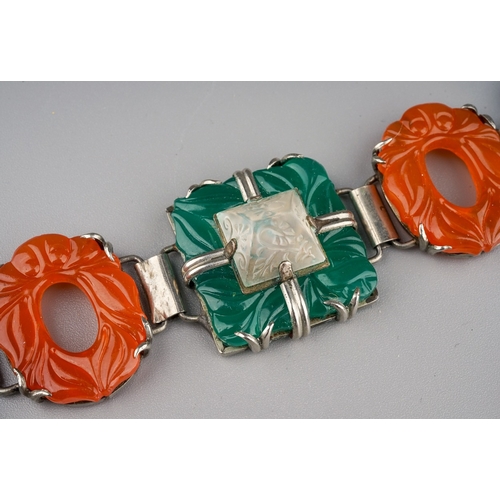 102 - A white metal a coloured paste bracelet, approx 20cm long; together with a carved green stone brooch... 