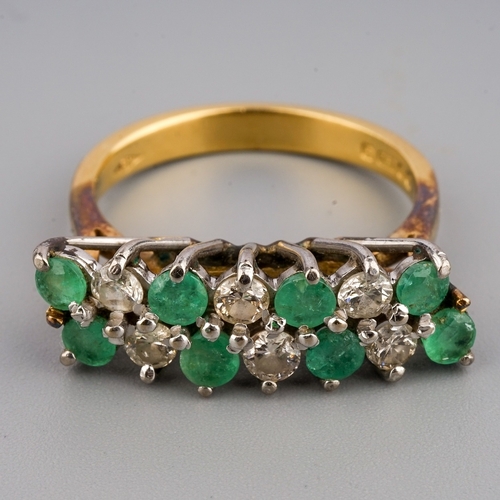 108 - An 18ct yellow gold diamond and emerald dress ring, two rows of alternating round emeralds and brill... 