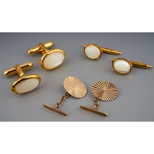 117 - A pair of 9 ct gold cufflinks ( weight 2.1 g) along with a pair of mother of pearl cufflinks marked ... 