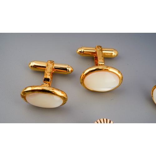 117 - A pair of 9 ct gold cufflinks ( weight 2.1 g) along with a pair of mother of pearl cufflinks marked ... 