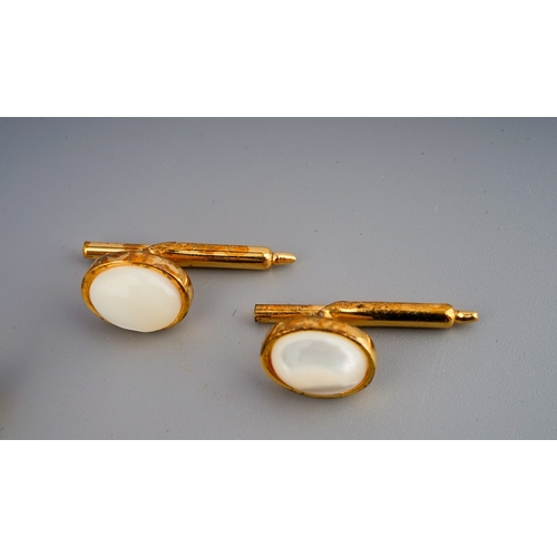 117 - A pair of 9 ct gold cufflinks ( weight 2.1 g) along with a pair of mother of pearl cufflinks marked ... 