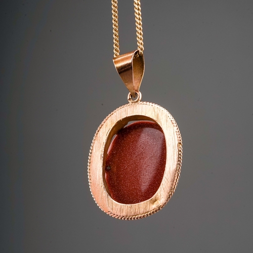 137 - Yellow metal mounted gold stone pendant, partial marks. On 9 ct gold chain. Gross weight 8.1g