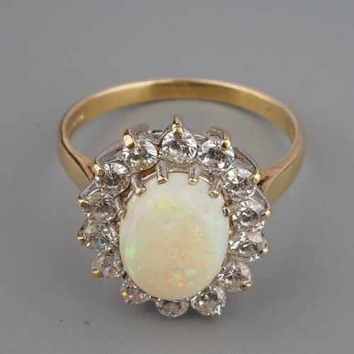 151 - A 9ct yellow gold opal and CZ oval cluster ring, size Q, gross weight approx 3.5g