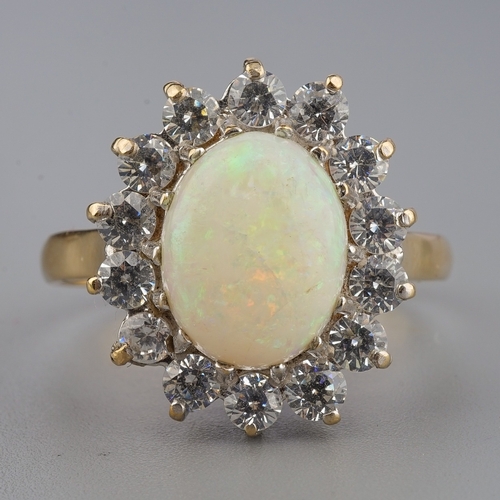 151 - A 9ct yellow gold opal and CZ oval cluster ring, size Q, gross weight approx 3.5g