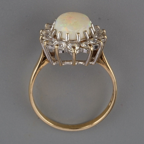 151 - A 9ct yellow gold opal and CZ oval cluster ring, size Q, gross weight approx 3.5g