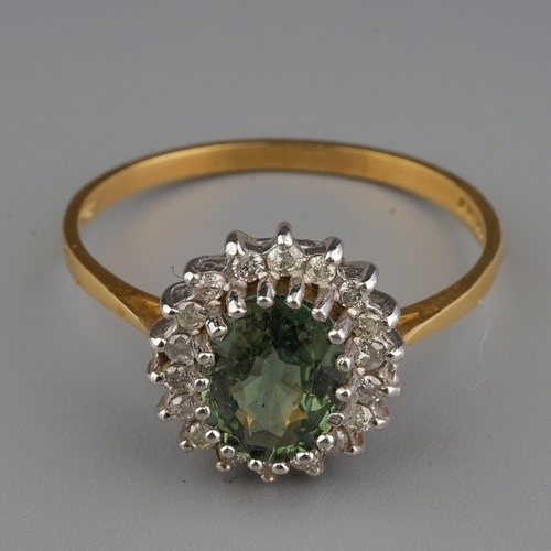 154 - An 18ct yellow gold peridot and diamond oval cluster ring, size S, gross weight approx 
3.1g