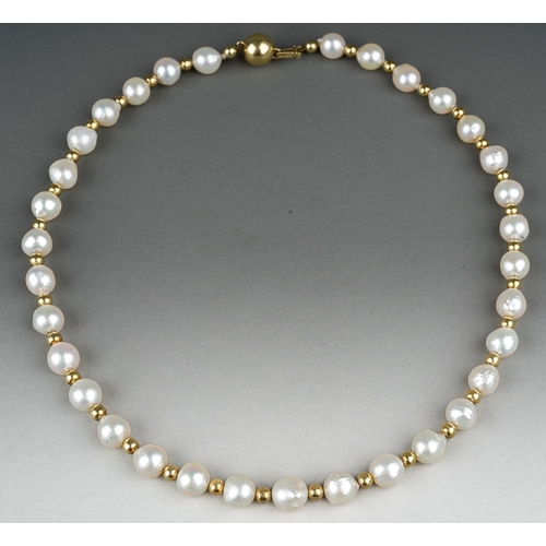 204 - A single row string of pearls, with a 14k gold ball clasp and gold ball spacers, approx 42.5cm long