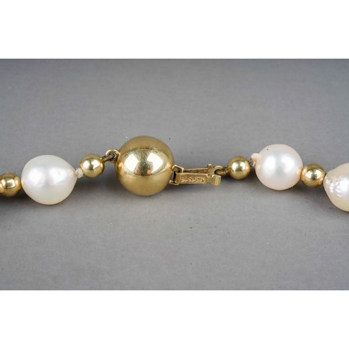 204 - A single row string of pearls, with a 14k gold ball clasp and gold ball spacers, approx 42.5cm long