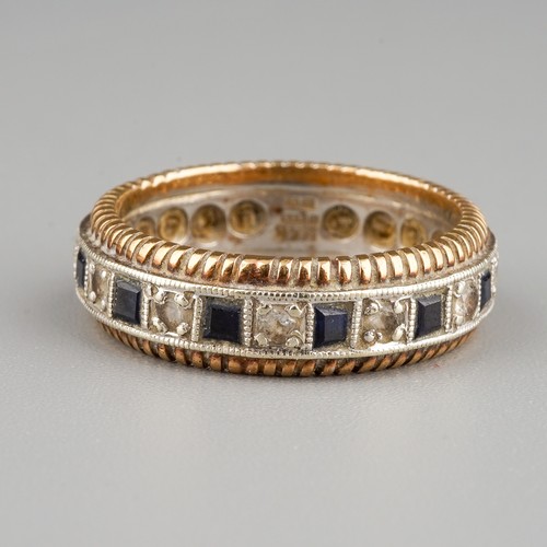 212 - A 9ct white and yellow gold eternity ring, set with alternating white and blue stones, size M, gross... 