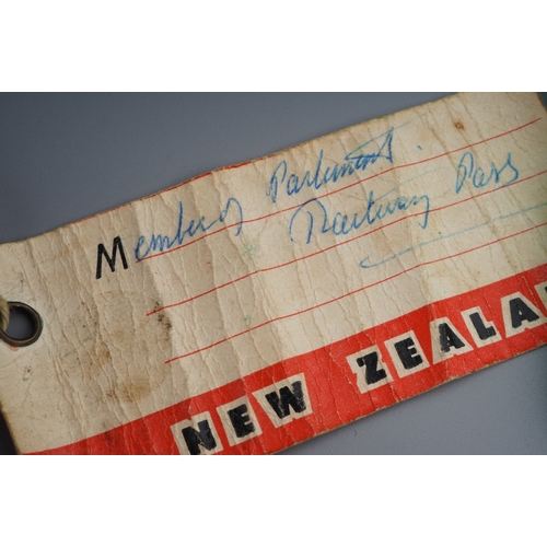 223 - New Zealand Interest - a late 19th century gold parliamentary railway pass, designed as a Maori Waha... 