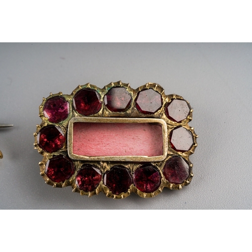 224 - A 19th century rectangular yellow metal memorial brooch, set with foil back purple paste, approx 3.9... 