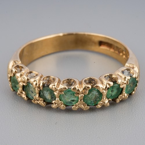 228 - A 9ct yellow gold and emerald seven-stone ring, size K1/2, gross weight approx 2.9g