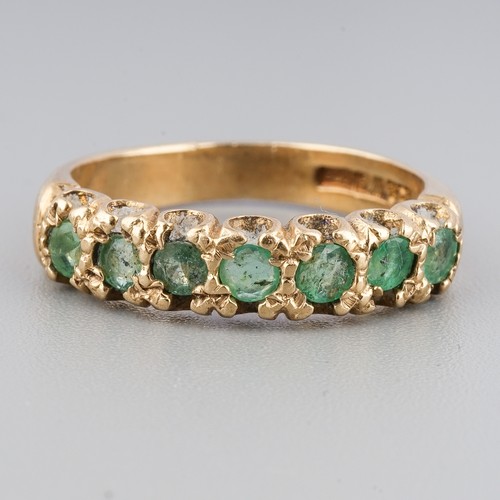 228 - A 9ct yellow gold and emerald seven-stone ring, size K1/2, gross weight approx 2.9g