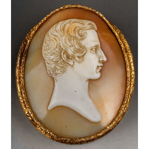 229 - A 19th century oval cameo brooch, carved depicting the profile of a gentleman, mounted in an engrave... 