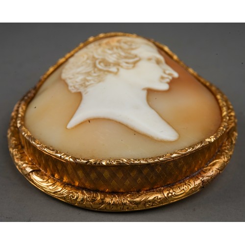 229 - A 19th century oval cameo brooch, carved depicting the profile of a gentleman, mounted in an engrave... 