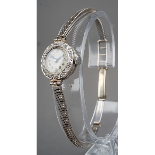 244 - Vintage ladies platinum and diamond cocktail watch, fitted with a 9 ct white gold strap. Gross weigh... 