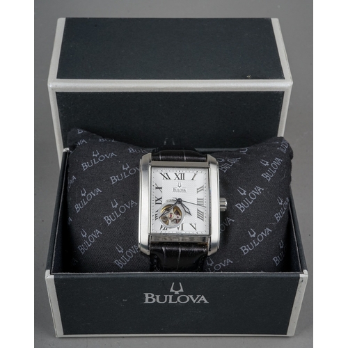 246 - Bulova men's watch 21 jewels open heart automatic. With original strap, box and paperwork