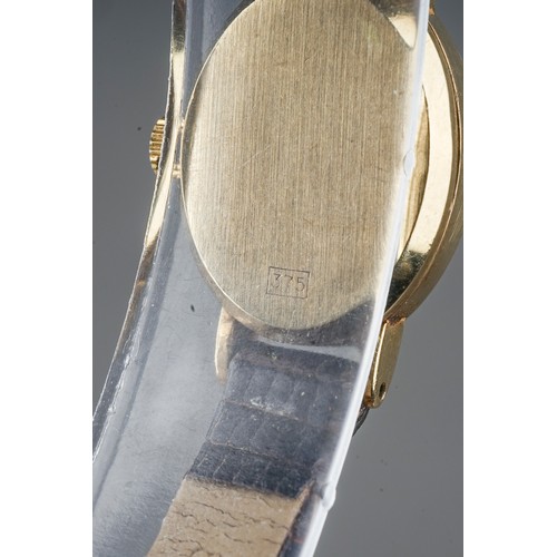 252 - A ladies 9ct yellow gold case Tissot wristwatch, brown leather strap