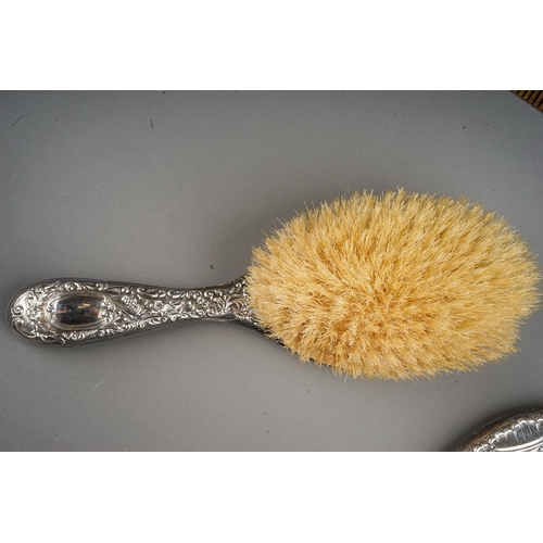 266 - An early 20th Century silver mounted part dressing table set to include mirror, hair brush and comb,... 