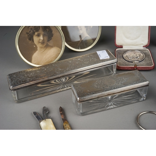 267 - A group of silver to include: two various early 19th Century silver mounted travelling case glass bo... 