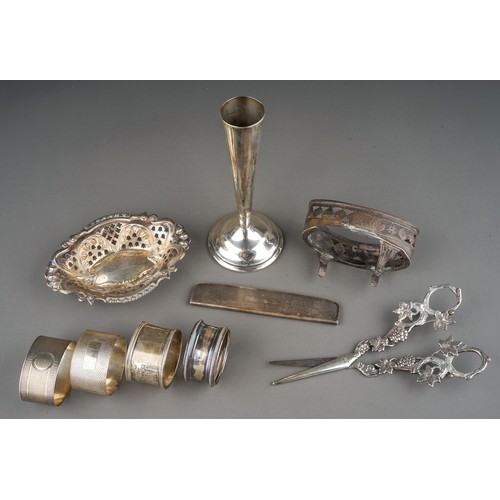 268 - A small parcel of silver, comprising four various napkin rings, a late Victorian bonbon dish with re... 