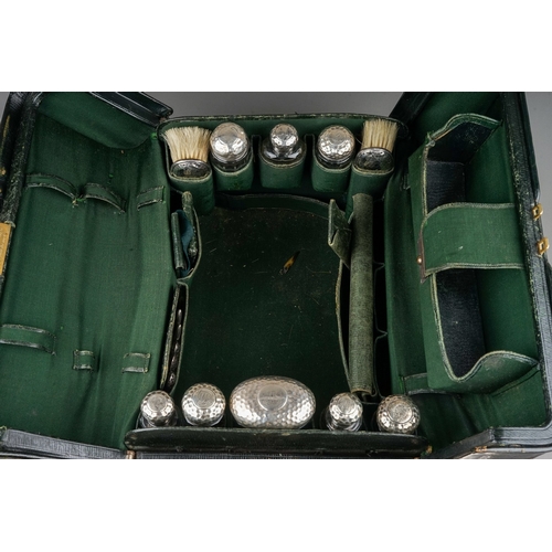 273 - Antique Mappin and Webb leather vanity case with silver mounted content to include dressing table br... 