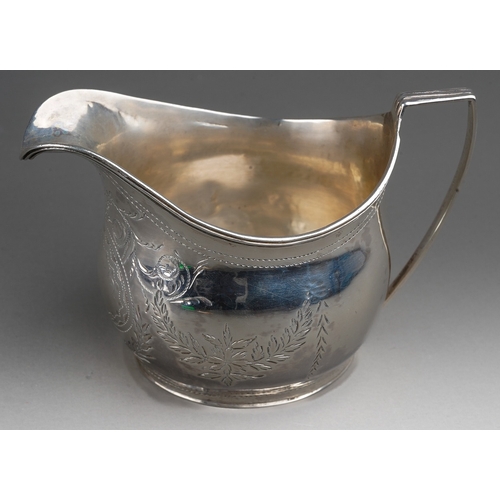 280 - A George III silver bright-cut engraved helmet shaped cream jug, hallmarked by WH possibly William H... 