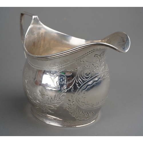 280 - A George III silver bright-cut engraved helmet shaped cream jug, hallmarked by WH possibly William H... 