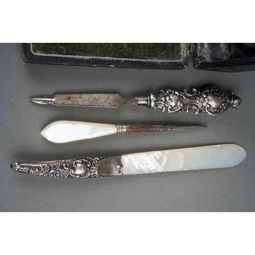 283 - An Edwardian silver boxed manicure set, hallmarked Chester, 1909 together with three further impleme... 