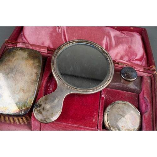 285 - A George V plain silver mounted dressing table \ travelling set comprising: brush, mirror, powder pu... 